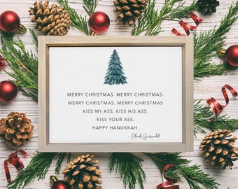 May include: A framed print with a watercolor Christmas tree illustration. The text reads "Merry Christmas" and "Kiss My Ass" with a "Happy Hanukkah" message, attributed to Clark Griswold. The print is surrounded by pine needles, red ornaments, and pine cones.