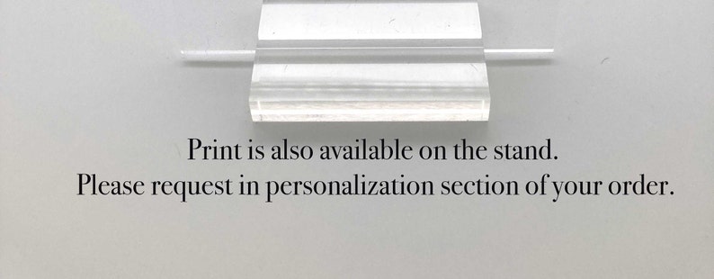 May include: A clear acrylic stand with a white text label that reads "Print is also available on the stand. Please request in personalisation section of your order."