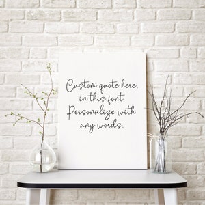 May include: White canvas print with black text that reads "Custom quote here. In this font. Personalize with any words."