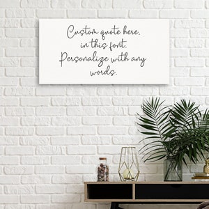 May include: White canvas with black text that reads "Custom quote here. in this font. Personalize with any words."