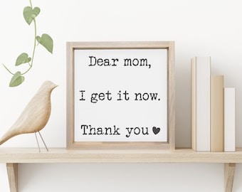 May include: A framed sign with the text "Dear mom, I get it now. Thank you" with a heart symbol.
