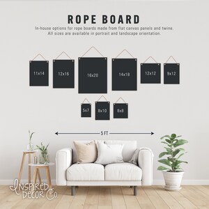 May include: A white wall with a variety of black canvas rope boards hanging on it. The boards are different sizes, including 11x14, 12x16, 16x20, 14x18, 12x12, 9x12, 5x7, 8x10, and 8x8 inches. The boards are hanging on a white wall with a white couch and a plant in the foreground. The text "ROPE BOARD" is at the top of the image. The text "INSPIRED Decor Co." is at the bottom of the image.