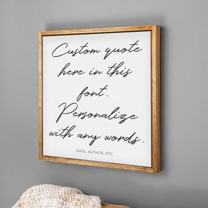 May include: A wooden framed canvas print with the text "Custom quote here in this font. Personalize with any words. DATE, AUTHOR, ETC."