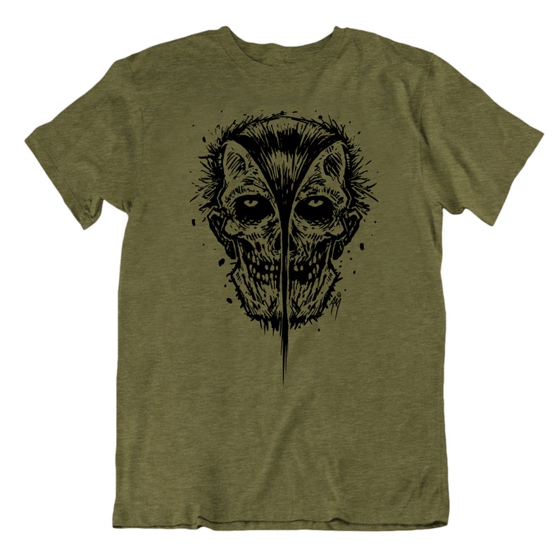 May include: A green t-shirt with a black and white graphic print of a skull with a split face.