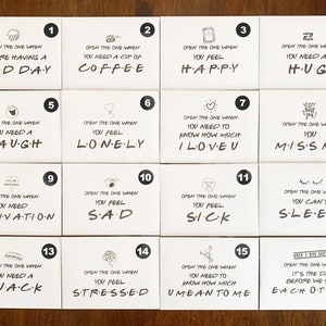 May include: Set of 16 white cards with black numbers and illustrations. Each card has a message about a feeling or situation, such as "Open the one when you are having a bad day" or "Open the one when you need a hug".