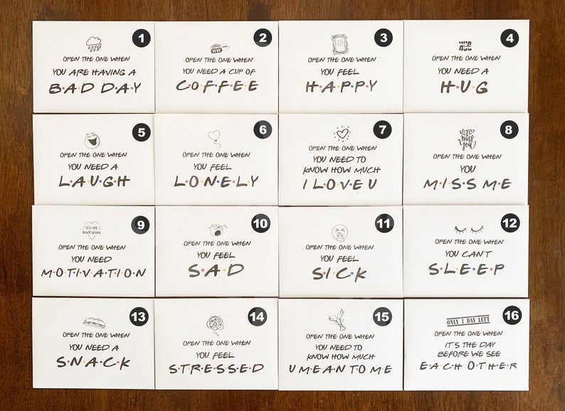 May include: Set of 16 white cards with black numbers and illustrations. Each card has a message about a feeling or situation, such as "Open the one when you are having a bad day" or "Open the one when you need a hug".