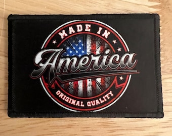 May include: Black patch with a white circle containing a red, white, and blue American flag with the text "Made in America" above the flag and "Original Quality" below the flag.