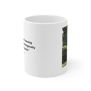 May include: White ceramic mug with a black quote that reads "Running is biologically good." and a photo of a person running in a park.