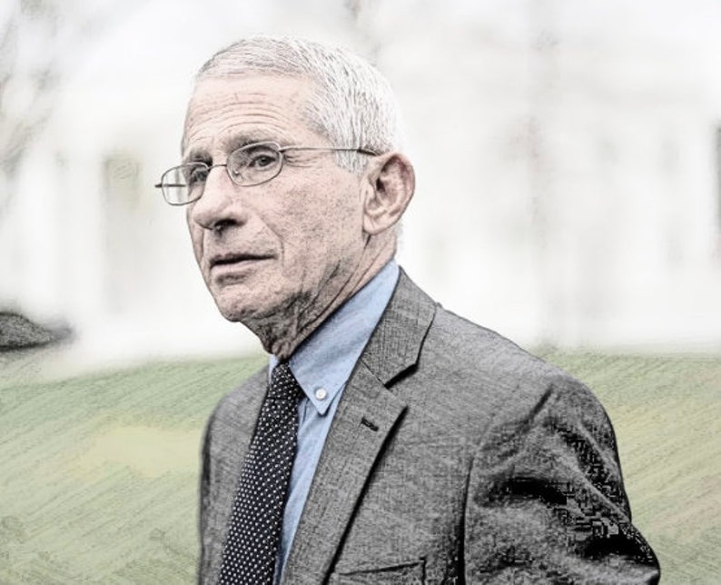 May include: A man with gray hair and a gray suit is wearing a light blue shirt and a dark blue tie with white polka dots. He is wearing glasses and has a serious expression on his face.