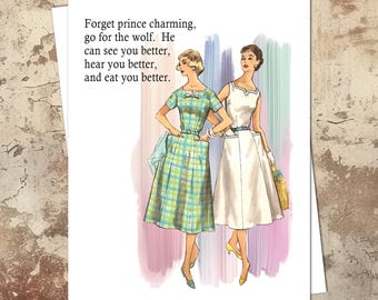 May include: A vintage-style greeting card with a humorous message about wolves and a pair of women in dresses. The text reads: "Forget prince charming, go for the wolf. He can see you better, hear you better, and eat you better."