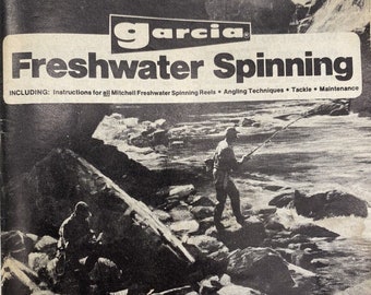May include: A black and white image of a fishing guide book with the title "Garcia Freshwater Spinning" and the text "INCLUDING: Instructions for all Mitchell Freshwater Spinning Reels. Angling Techniques Tackle. Maintenance". The image shows two anglers standing on rocks by a river.