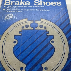 May include: A blue and white box with the Bendix logo and the words "Organic New Brake Shoes" printed on it. The box features a graphic of a brake shoe and the text "Limited Lifetime Warranty".