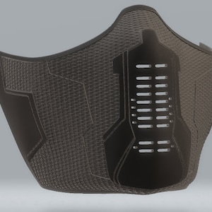 May include: A black face mask with a geometric design and a grid pattern. The mask has a large, open area in the centre with a series of small holes.
