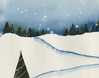May include: Watercolor painting of a snowy winter landscape. A dark green Christmas tree with gold accents and a star on top stands in the foreground. The background features a line of dark green trees and a light blue sky with falling snow.
