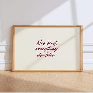 May include: A handmade wooden sign with the text "Welcome to our home" in a handwritten style. The sign is painted white with a distressed finish and a black border. It is designed to be hung on a wall.
