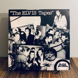 May include: A vintage album cover for "The ELVIS Tapes" featuring a collage of black and white images of Elvis Presley. The cover includes text such as "JOR RED ROBINSON YOUR HOST FOR ELVIS PRESLEY" and "ELVIS PRES SHOW". The album is from "The great music company".