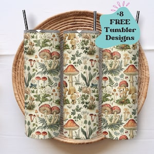May include: Three stainless steel tumblers with a white background and a repeating pattern of mushrooms, ferns, and other botanical illustrations. The tumblers are arranged in a row on a woven basket.