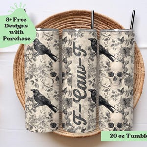 May include: Three 20 oz tumbler wraps with a black and white floral and skull design, featuring crows and the text "F-Law-F". The tumblers are displayed on a woven tray, with a light green banner that says "8+ Free Designs with Purchase".