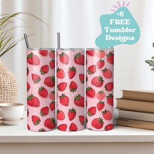 May include: Three stainless steel tumblers with a pink background and a pattern of red strawberries. Each tumbler has a black straw. The image also includes a text bubble that says "+8 FREE Tumbler Designs".
