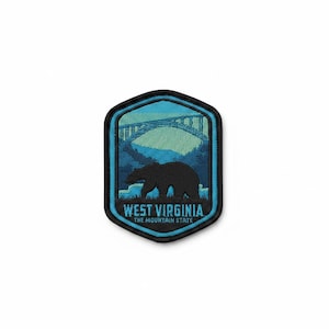 May include: A hexagonal embroidered patch featuring a black bear silhouette in the foreground, a large arched bridge in the background, and the text WEST VIRGINIA THE MOUNTAIN STATE in blue lettering against a blue and green landscape design.