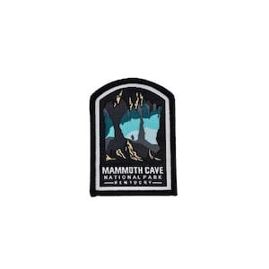 May include: Black and white embroidered patch with a blue and white cave illustration. The text "MAMMOTH CAVE NATIONAL PARK KENTUCKY" is printed below the illustration.