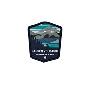 May include: A blue and green embroidered patch with a mountain scene and the text "Lassen Volcanic National Park".