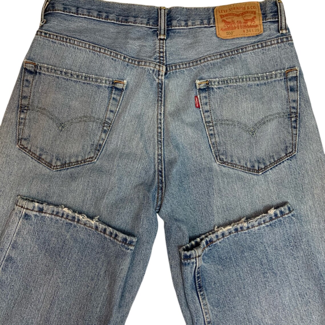 Vintage 90s Levi’s distressed blue relaxed fit jeans