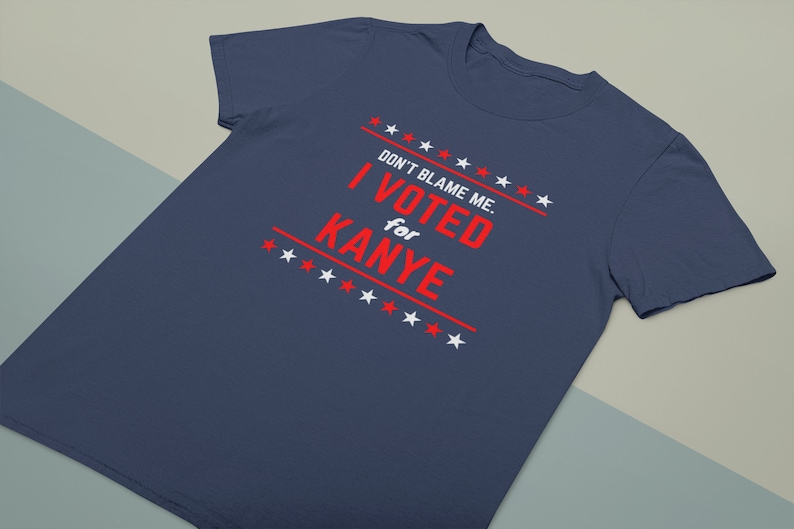 May include: A navy blue t-shirt with a white star pattern and red text that reads "DON'T BLAME ME. I VOTED for KANYE".