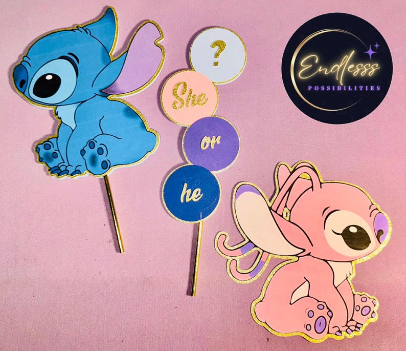 May include: A blue and pink gender reveal cake topper set featuring cartoon characters. The set includes a blue Stitch character, a pink Angel character, and signs that read "She or he?" and a question mark. The toppers have gold accents.