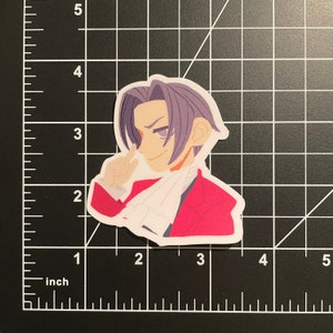May include: A sticker of a cartoon character with purple hair, wearing a red jacket and a white collar. The character is smiling and has one hand raised to their chin.