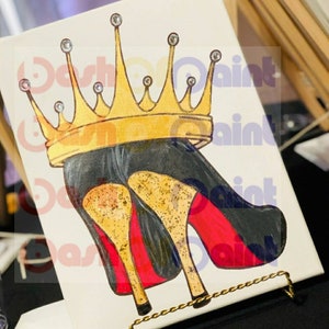 May include: A painting of a pair of red high heels with a gold crown on top. The heels are black with gold glitter and red soles. The crown is adorned with rhinestones.