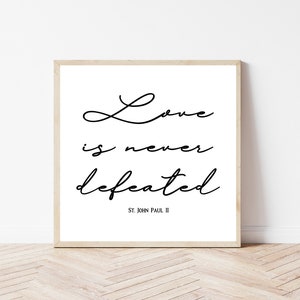 St. John Paul II quote, &quot;Love is never defeated.&quot;  | Printable Catholic home decor | Catholic print | Catholic saint quote | Catholic gift
