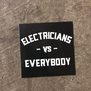 May include: Black and white sticker with the text "Electricians - vs - Everybody" on a black background.