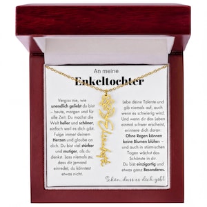 An meine Enkeltochter necklace with a gold pendant featuring a flower design.