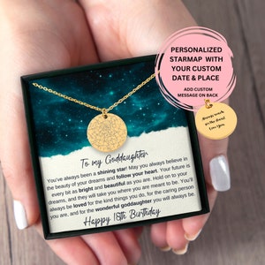 May include: A gold necklace with a round pendant featuring a star map design. The necklace is in a black box with a card that reads "To my Goddaughter" and "Happy 18th Birthday".