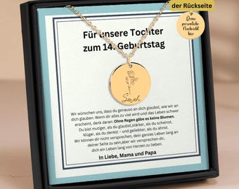 May include: A gold necklace with a round pendant engraved with the name "Sarah" and a floral design. The necklace is in a black box with a message that reads "For our daughter on her 14th birthday".