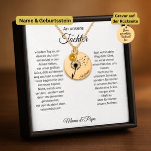 The image is a necklace with a pendant featuring a dandelion seed, accompanied by a card with a personal message in German.