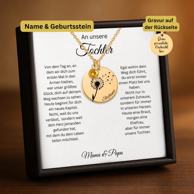 The image is a necklace with a pendant featuring a dandelion seed, accompanied by a card with a personal message in German.