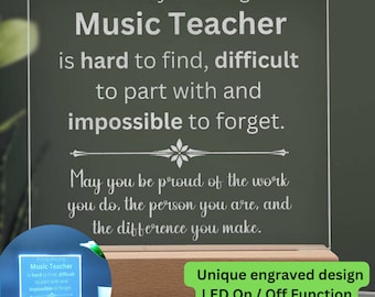 May include: A personalized LED light with a wooden base. The clear acrylic panel is engraved with the words "A truly amazing Music Teacher is hard to find, difficult to part with and impossible to forget."
