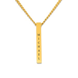 A gold-colored necklace with a rectangular pendant that has the name "Michael" engraved on it.