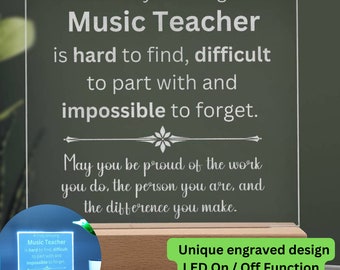 May include: A white acrylic plaque with a wood base and an LED light. The plaque has an engraved message that reads "A truly amazing Music Teacher is hard to find, difficult to part with and impossible to forget. May you be proud of the work you do, the person you are, and the difference you make." The plaque has a unique engraved design and an LED on/off function.