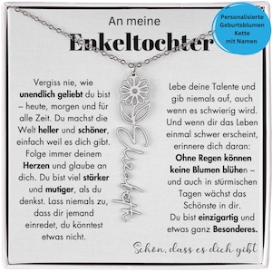 An eukeltochter necklace with a pendant featuring a flower design. The text on the necklace is in German and provides a personalised message.