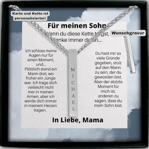 Peut inclure: Un collier en argent avec un pendentif en forme de barre gravé des lettres "MICHAEL". Le collier est dans une boîte noire avec une carte qui dit "Pour mon fils" et un message sur l'amour et la fierté qu'un parent ressent pour son enfant. La carte comprend également le texte "Wunschgravur" qui signifie "gravure personnalisée" en allemand.
