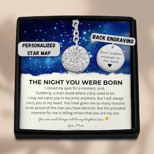 May include: A silver star map pendant with a chain, displayed in a black box. The pendant has a star chart design and the words "Back Engraving" and "Your custom message on the back." The text "The Night You Were Born" is also visible.