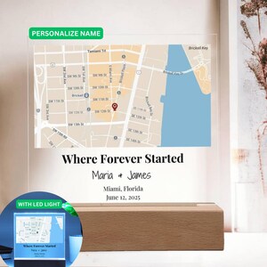 May include: A personalized map art piece with the text "Where Forever Started" and the names "Maria & James." The map shows a section of Miami, Florida, with a date of June 12, 2025. The piece is mounted on a wooden base.
