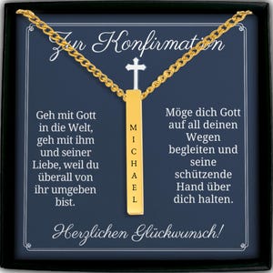 The image is a necklace with a pendant that says "Michael" in gold. The necklace is displayed in a black box with a white border. The box contains German text that reads "Zur Konfirmation Michael mit Gott in die Welt, geh mit imm und seiner Liebe, weil duiberall von ihr umgeben bist. Herglichen Glickwunsch!"