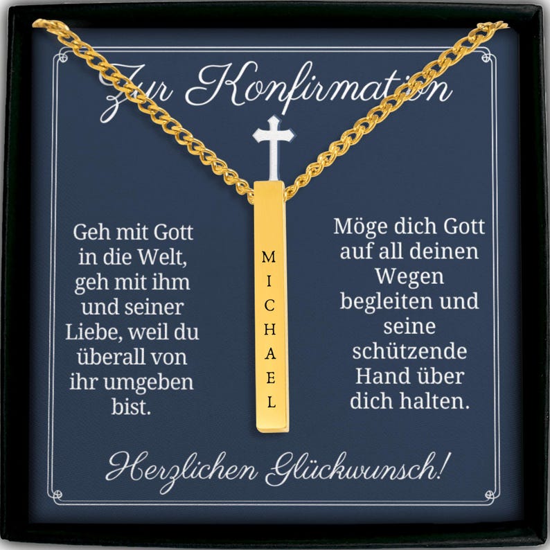The image is a necklace with a pendant that says "Michael" in gold. The necklace is displayed in a black box with a white border. The box contains German text that reads "Zur Konfirmation Michael mit Gott in die Welt, geh mit imm und seiner Liebe, weil duiberall von ihr umgeben bist. Herglichen Glickwunsch!"