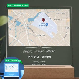 May include: A personalized map art piece featuring a map of Dallas Love Field Airport. The text reads "Where Forever Started" with names and a date. The piece is illuminated with an LED light and set on a wooden base.