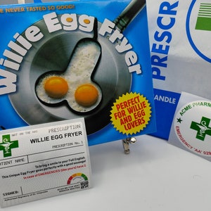 May include: A novelty egg frying pan in a blue box with the text "Willie Egg Fryer". The pan's design includes two fried eggs. Also included are a prescription card and a pharmacy bag and sticker.