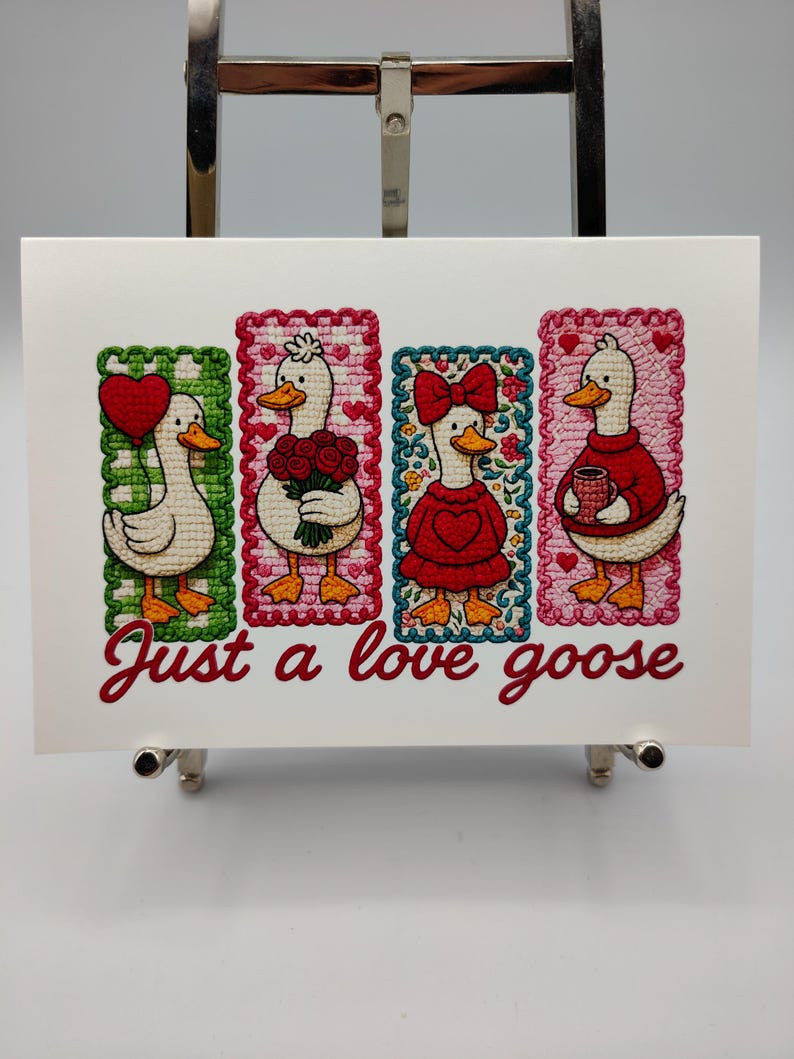May include: A greeting card featuring four cartoon geese in rectangular frames. Each goose is dressed differently, holding a heart, flowers, wearing a bow, and holding a mug. The text "Just a love goose" is written in cursive below the geese.